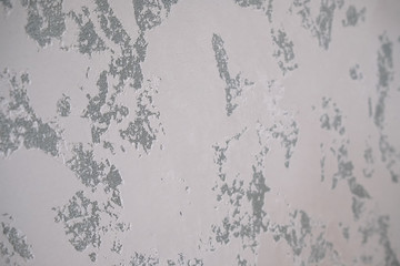 Marble background or texture. The decorative marble plaster painted on the wall mimics the natural...