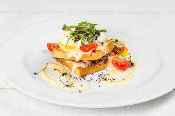 Fresh greens egg sandwich on a white plate