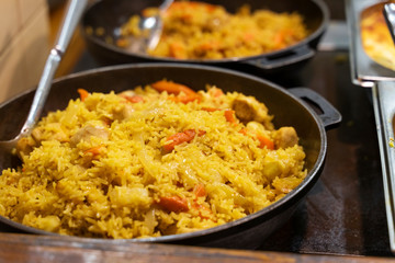rice with vegetables in a large cup in a restaurant