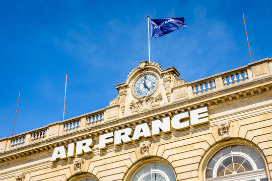 Paris, France - July 8, 2019: The Air France sign is affixed to the facade of the former Invalides railway station since it was converted into an air terminal to serve Paris Orly airport in 1948.