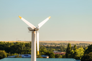 Wind turbine in rural area. Alternative energy in countryside.