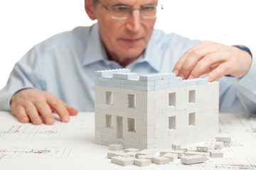 Architect constructing a house