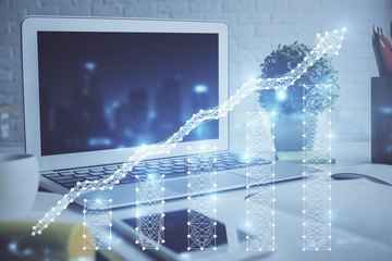 Forex market chart hologram and personal computer background. Multi exposure. Concept of investment.