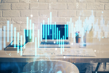 Financial market graph hologram and personal computer on background. Double exposure. Concept of forex.
