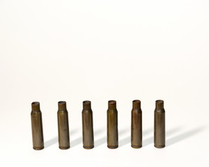 empty shells from cartridges for a firearm on a white background
