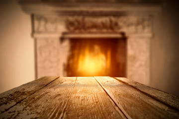 Desk of free space and home interior with fireplace 