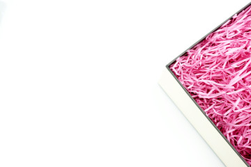 Shredded paper packing material in a square box using to protect fragile object while in transport....