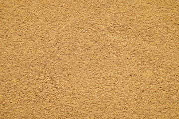 Top view close up on beach sand. Seamless texture of sea sand. Summer abstract background