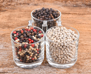 Pepper mix  on wooden background.