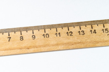 wooden ruler close-up on a white background top view