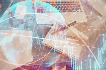 Financial graph displayed on woman's hand taking notes background. Concept of research. Multi exposure