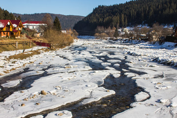 The frozen river Prut in the Carpathian village of Yaremche. Ukraine