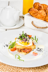 Viennese waffles with egg, tomato, radish on a white background