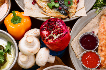Pomegranate fruit. Pomegranates over Red Background. Organic Bio fruits