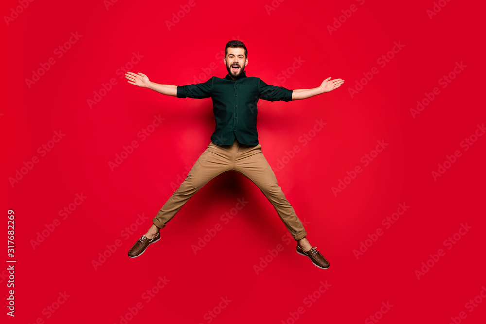 Sticker Full body photo of crazy funky guy have spring active weekends jump raise hands scream wear brown stylish clothes isolated over shine color background