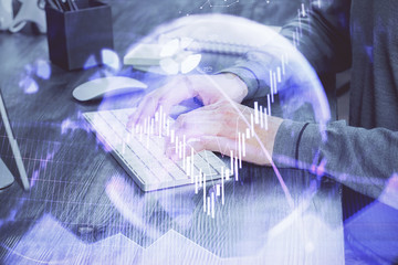 Multi exposure of financial graph with man works in office on background. Concept of analysis.
