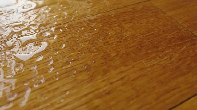 Parquet. Water falling on the wooden floor. 