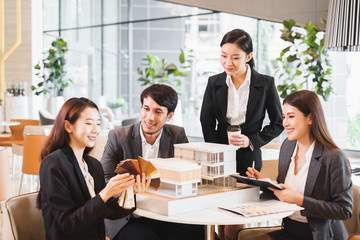 Group of young asian business people meeting in office for house real estate residence project