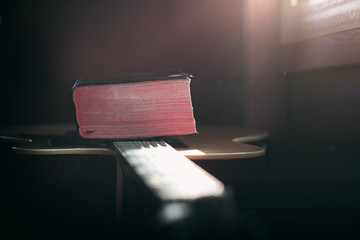 Close up the Bible on acoustic guitar with light in morning, christian worship concept.