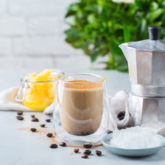 Keto, ketogenic bulletproof coffee with coconut oil and ghee butter
