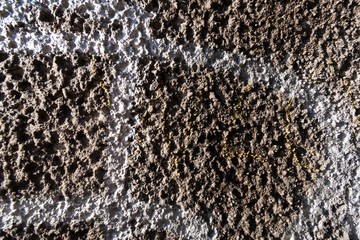 wall with rough texture and spray paint 
