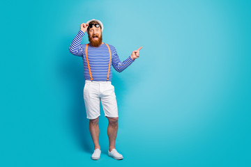 Full length photo surprised excited man look incredible sales discount point index finger copyspace...