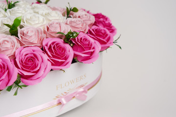 Flowers in bloom: Bouquet of pink roses on a white background. Closeup with details of roses background.