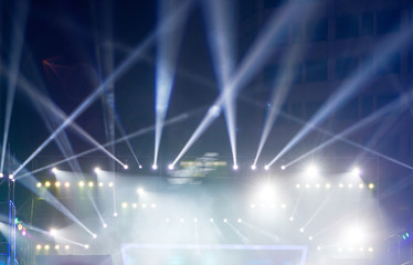 multiple spotlights on a theatre stage lighting rig