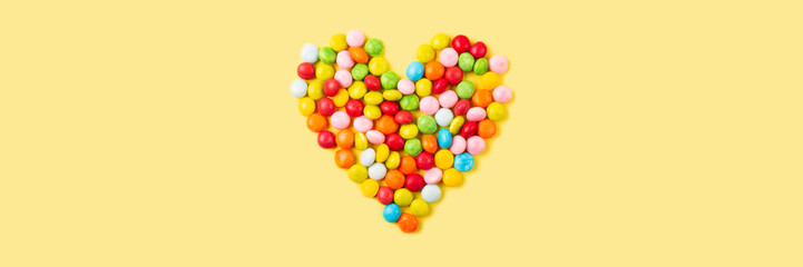 Old fashion pale multi colored candy heart background