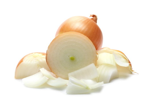 Onion bulb cut in half and chopped slices isolated on white background