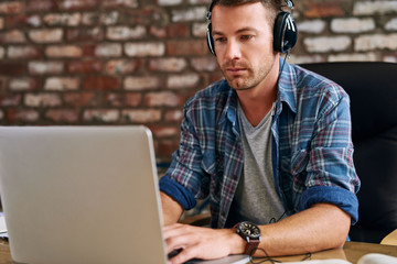 Queuing up his work playlist