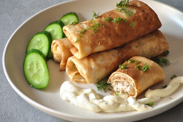 Lunch, dinner. Pancakes with meat and cucumber