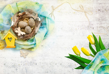 Spring composition by Easter: nest with eggs