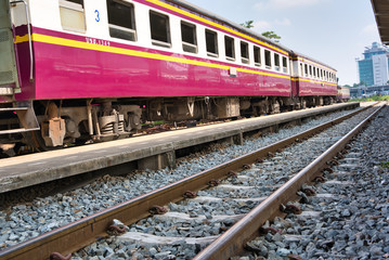 Fototapeta na wymiar Train tracks with a train standing on the tracks