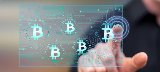 Man touching a bitcoin concept