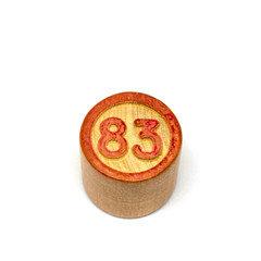 Wooden lotto barrels with numbers, bingo game. Board family game. Isolated on white background.