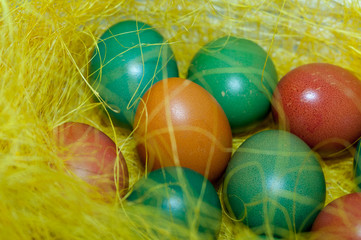 Colored Easter eggs in basket. Selective focus.