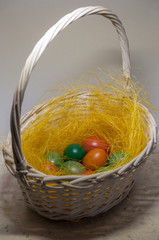Colored Easter eggs in basket. Selective focus.