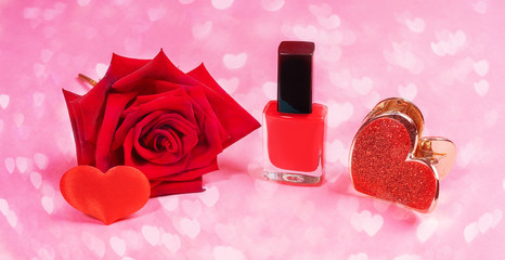 Obraz na płótnie Canvas Close up red: nail polish, hair clip, rose and small heart on pink background with hearts bokeh. Women beauty concept.