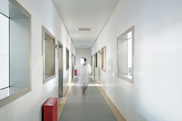 people walking in the corridor of hospital laboratory, blur motion.