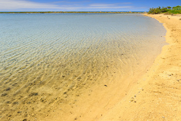 The most beautiful sandy beaches of Apulia: Porto Cesareo marine, Salento coast. ITALY (Lecce). View of Big Island (or Isola Grande) Nature Reserve also known as the Island of the Rabbits.