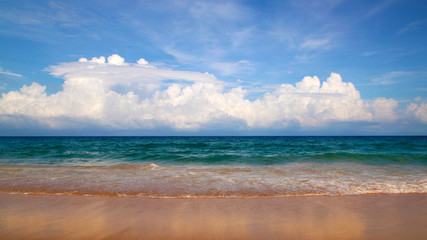 Fototapeta na wymiar Karon beach, tranquil sea and wonderful cloudy sky, Phuket, Thailand