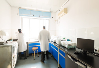 young researcher works in chemistry laboratory