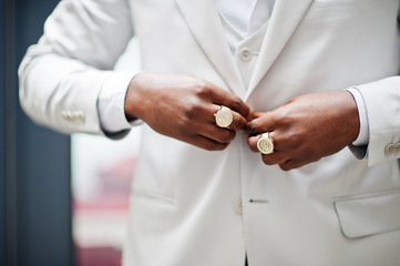 Fototapeta premium Close up hands with rings of handsome african american gentleman in formalwear.