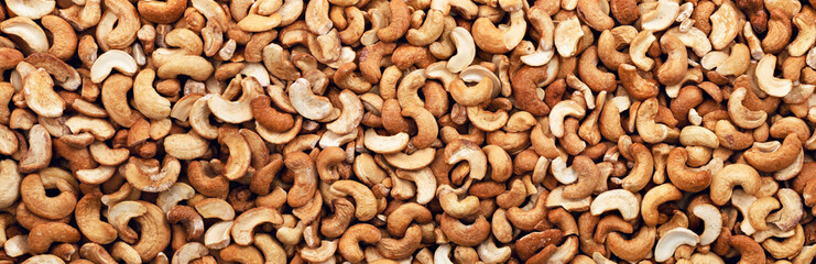 Cashew nuts peeled full background. Panorama. Banner.	