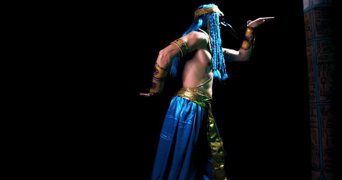 Egyptian deity Thoth with the head of ibis is dancing on black background, 4k