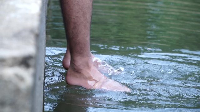 young guy enjoying leg in water travel relaxing bodies youth kerala pollution