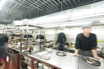 motion chefs of a restaurant kitchen