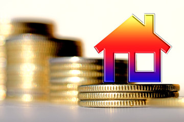 The symbol real estate on a background of money . The concept of price changes on the real estate...
