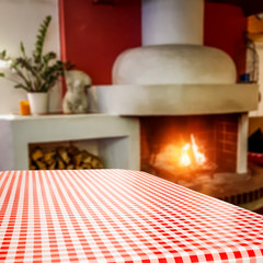 Desk of free space and fireplace in home interior 